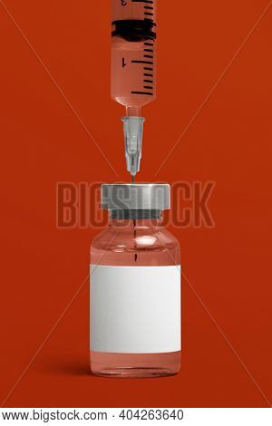 Blank white label on injection bottle glass vial with syringe