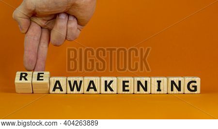 Reawakening Symbol. Businessman Turns Cubes And Changes The Word 'awakening' To 'reawakening'. Beaut