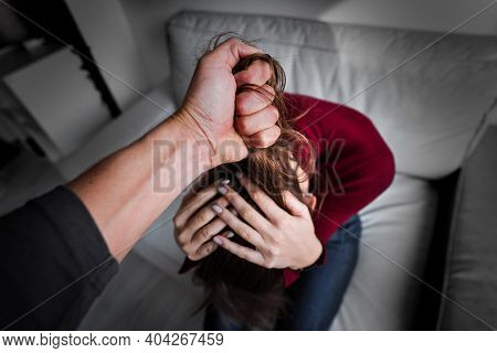Woman Victim Of Domestic Violence. Woman In Fear Of Domestic Abuse. Man Physically Abusing His Girlf