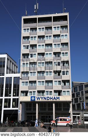 Cologne, Germany - September 21, 2020: People Walk By Wyndham Hotel In Cologne City, Germany. The Ho