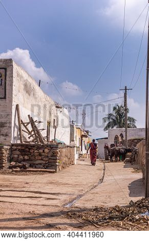 Lakundi, Karnataka, India - November 6, 2013: Typical Side Street With Central Gutter And White Pain
