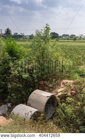 Lakundi, Karnataka, India - November 6, 2013: 2 Pieces Of Cement Pipes Used To Create A Bridge To St