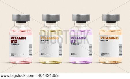 Vitamin injection glass bottles on beige background