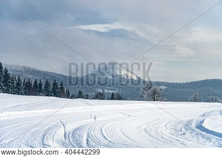 Winter Hilly Landscape Of Lusatian Mountains With Klic Mountain In The Middle. Czech Republic