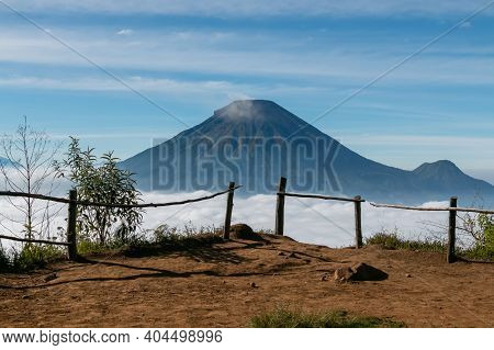 View Of The Sindoro Mountains With A Sea Of ​​clouds In Central Java, Indonesia From The Top Early I