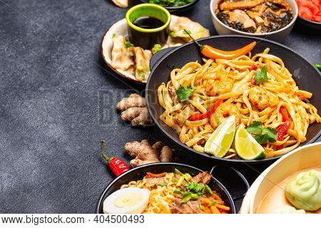 Assorted Of Different Asian Food. Chinese, Japanese And Thai Cuisine. Noodles, Dumplings Gedza, Baoz