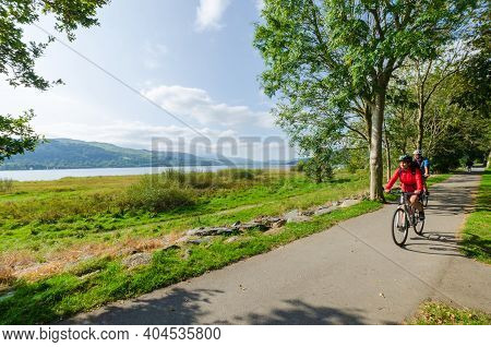 Bala; Uk: Sep 20, 2020: Cyclists Enjoy Riding Along An Asphalt Trail Beside Bala Lake, On A Sunny Su