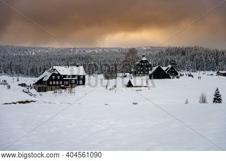 Winter In Jizera Mountains. Cloudy Evening In Jizerka Village, Czech Republic