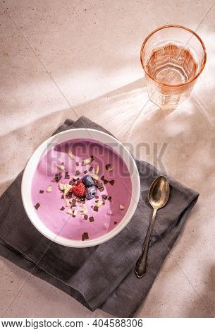 A Simple Summer Dinner Made Of A Big Bowl Of Berries Yoghourt With Some Chocolate And Nuts As Toppin