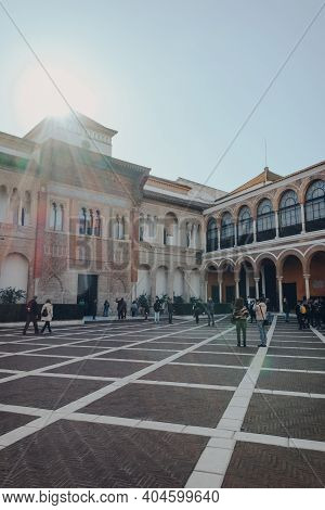Seville, Spain - January 19, 2020: People Walking On The Patio De La Monteria In Alcazar Of Seville,