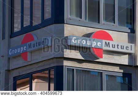 Lugano, Switzerland - 13th January 2021 : View Of Groupe Mutuel Assurance Company Sign Hanging In Lu