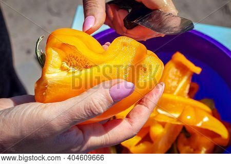 Cutting Ripe Peppers By Knife. Woman Cooking Vegetable Salad On Table Outdoors. Womans Hand Cuts Rip