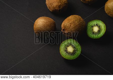 Kiwi Fruits Half Sliced On Dark Background