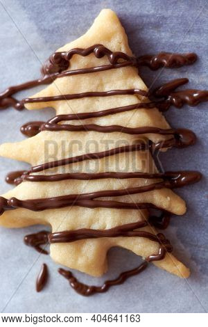 Pouring Chocolate On Just Baked Christmas Cookies
