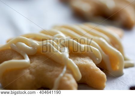 Pouring Chocolate On Just Baked Christmas Cookies
