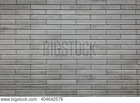 Grey Wall Tiles Imitating Brickwork. Modern Finishing Material. Gray Facade Facing Tiles, Imitating 
