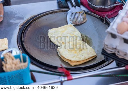 Roti Making, Roti Thresh Flour By Roti Maker With Oil. Indian Traditional Street Food. Thai Pancake 