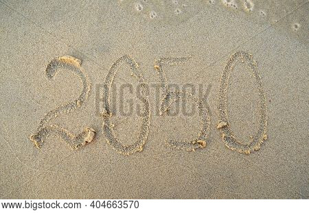 New Year, Number 2050 On Beach Sand. Holiday Concept. 2050 Plan