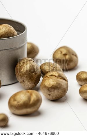Gray Metal Bowl Full Of Chocolate Pralines. Sweet Truffles With Cinamon, Cardamom And Clove On A Whi