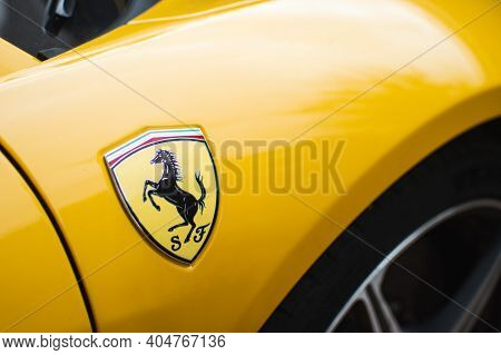 Kyiv, Ukraine - August 2020. Ferrari Nameplate On The Yellow Ferrari 458 Spider.