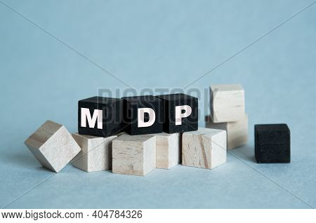 Mdp. The Text Is On The Dark And Light Cubes. Bright Solution For Business, Financial, Marketing Con