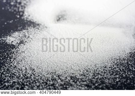 Makrogol Powder Photographed Against A Black Background In The Studio