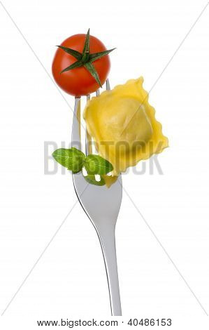 Ravioli Pasta Tomato And Basil On Fork Against White Background