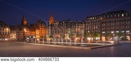 Strasbourg, Ebening In Central Place Kleber Square. Fountain In The Middle And Cathedral On Backgrou