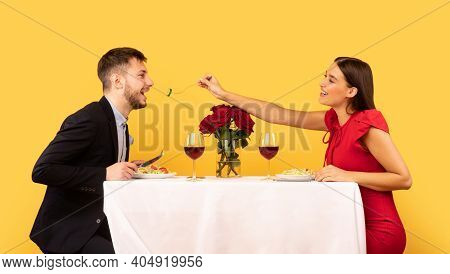 Loving Girlfriend Feeding Boyfriend During Date Having Romantic Dinner Celebrrating Relationship Ann