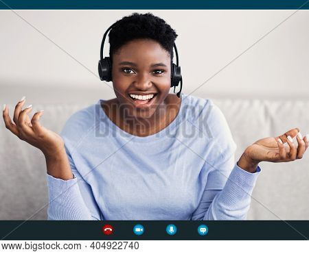 Remote Work And Technology. Black Woman Wearing Headset Having Video Conference, Talking To Camera D