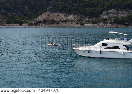 Jetski And Yachts On The Sea. Clear Sea Blue Sky. Motor Transport In The Sea, Scutter And Boats. Ant