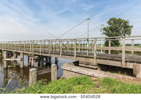 Wooden Bridge In Dutch National Park Weerribben