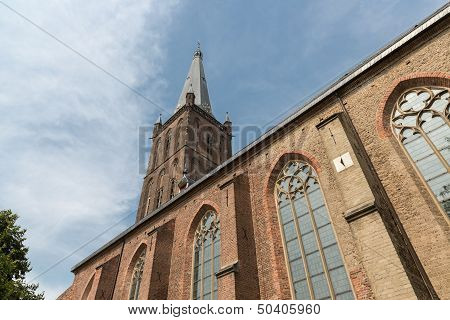 Dutch Church With Tower Against A Blue Sky