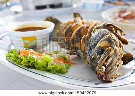 Fried Fish With Thai Spicy Seafood Sauce.