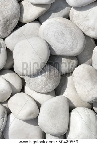 Pile of white stone, pebble, rock for background or texture