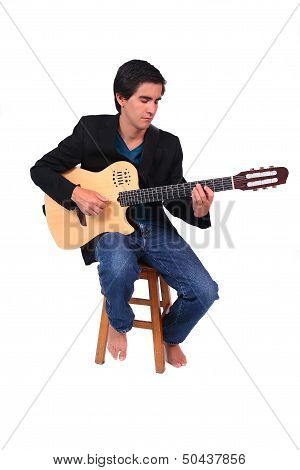 A Male Guitarrist In Action