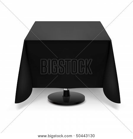 Square table with black tablecloth.