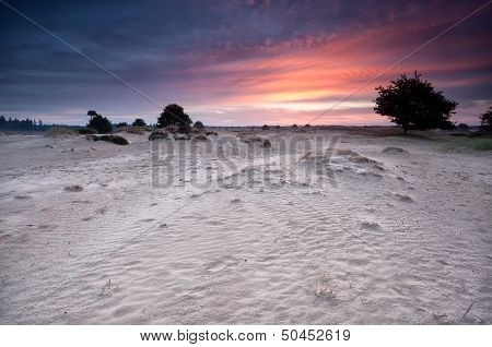 Dramatic Sunrise Over Sand Dunes