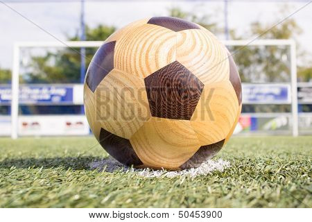 Wooden football on penalty spot