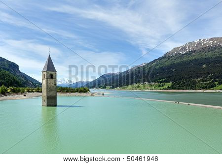 The Bell Tower In Reschensee And Family (italy).