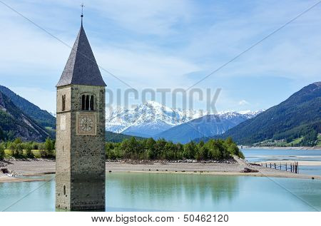 The Bell Tower In Reschensee And Family (italy).