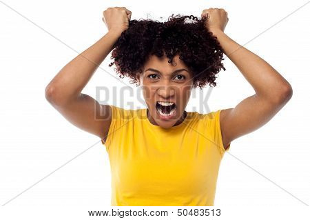 Angry Young Woman Pulling Her Hair Out