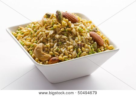Indian snack in white bowl isolated.
