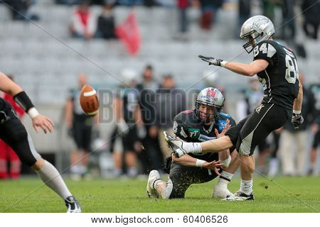 INNSBRUCK,  AUSTRIA - MAY 25 K Clemens Erlsbacher (#84 Raiders) kicks the ball during the EFL football game on May 25, 2013 in Innsbruck, Austria.