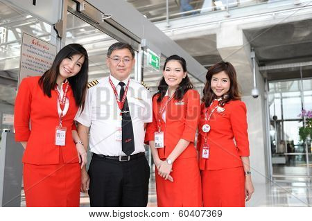 BANGKOK - OCT 27: Airasia crew members in Bangkok Airport on October 27, 2011 in Bangkok, Thailand. AirAsia Berhad is a Malaysian low-cost airline headquartered in Kuala Lumpur, Malaysia