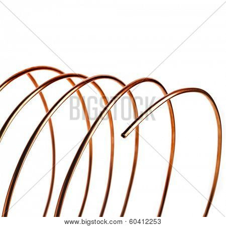 copper pipes close up isolated on white background