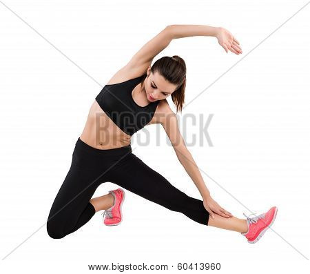 Beautiful Woman Dressed For Fitness Doing Stretching Exercises