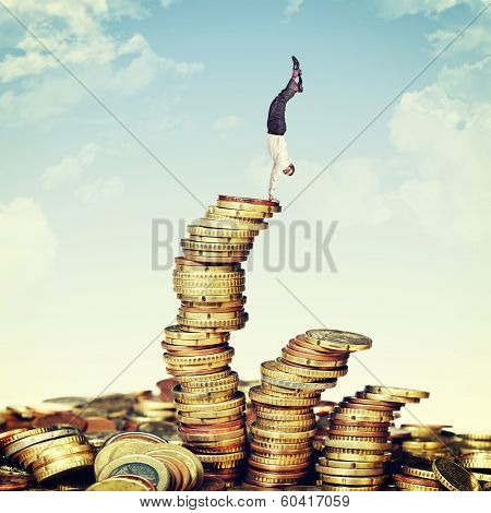 acrobat businessman on euro coin pile