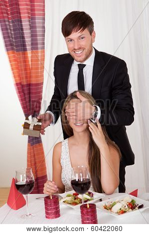 Man Surprising His Wife With A Gift