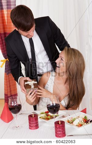 Man Surprising His Wife With A Gift